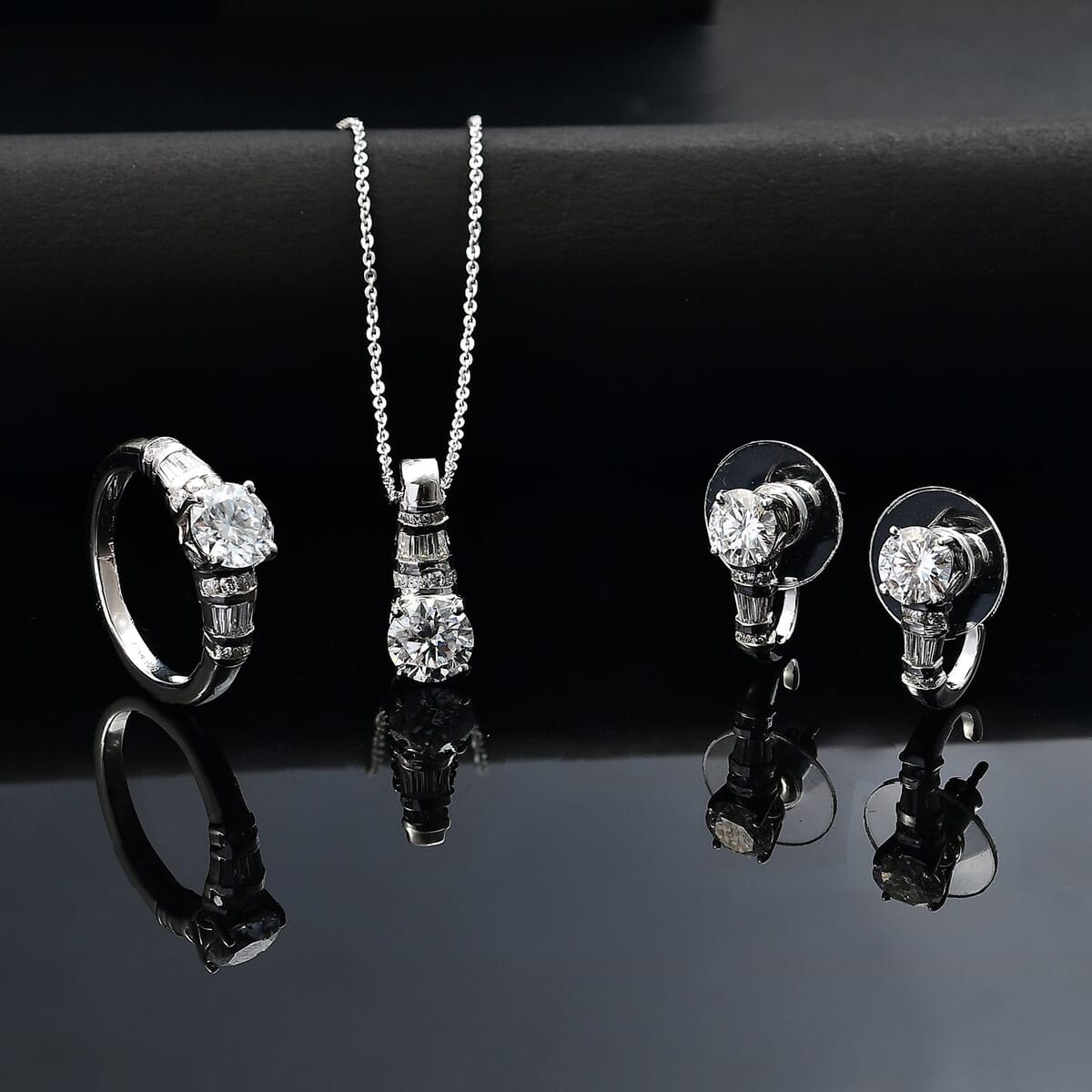 Moissanite 4.90 ctw Earrings, Ring (Size 6.0) and Pendant Necklace 20 Inches in Rhodium Over Sterling Silver image number 1