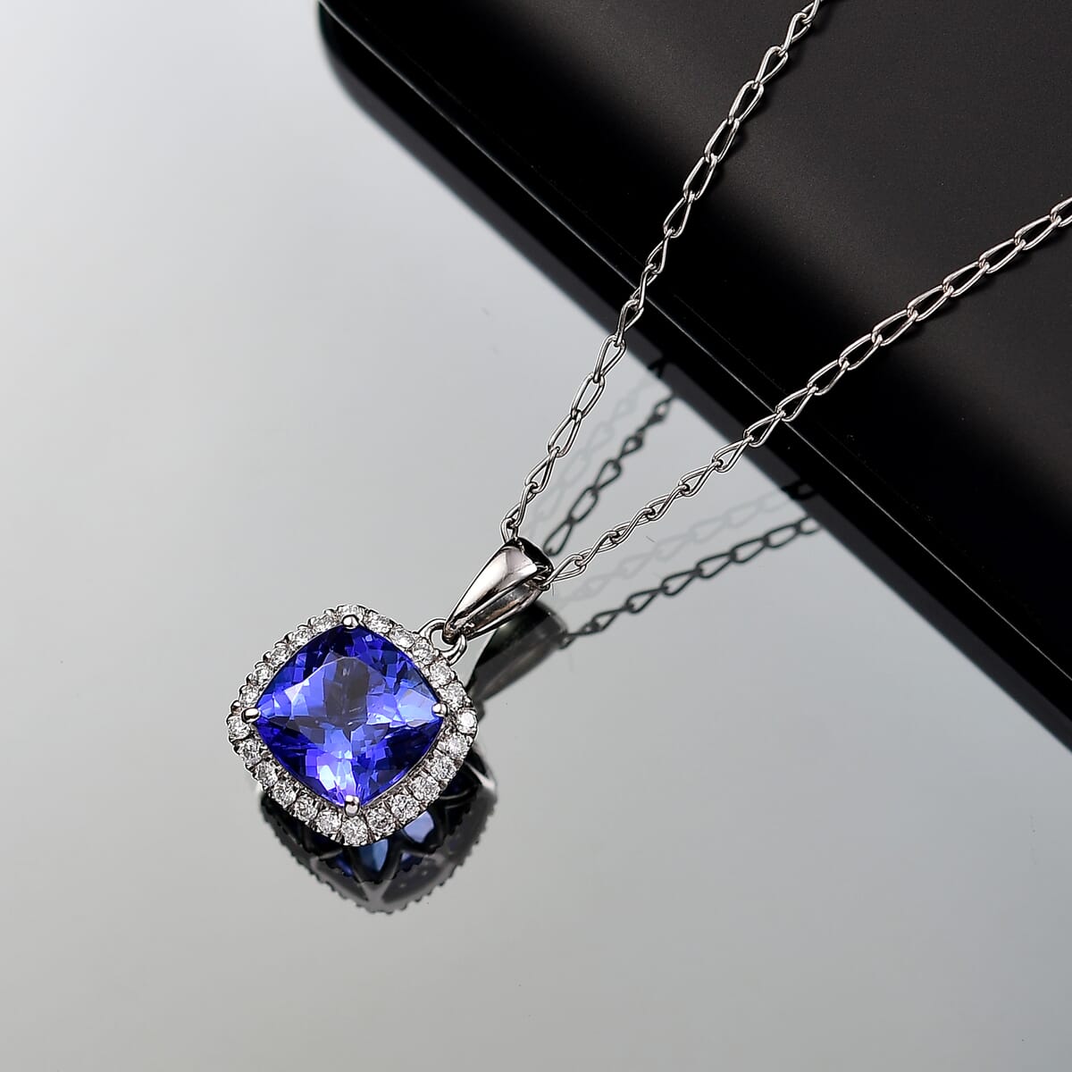 Certified & Appraised Rhapsody AAAA Tanzanite and E-F VS Diamond 2.29 ctw Halo Pendant Necklace in 950 Platinum 20 Inches (Del. in 10-15 Days) image number 1