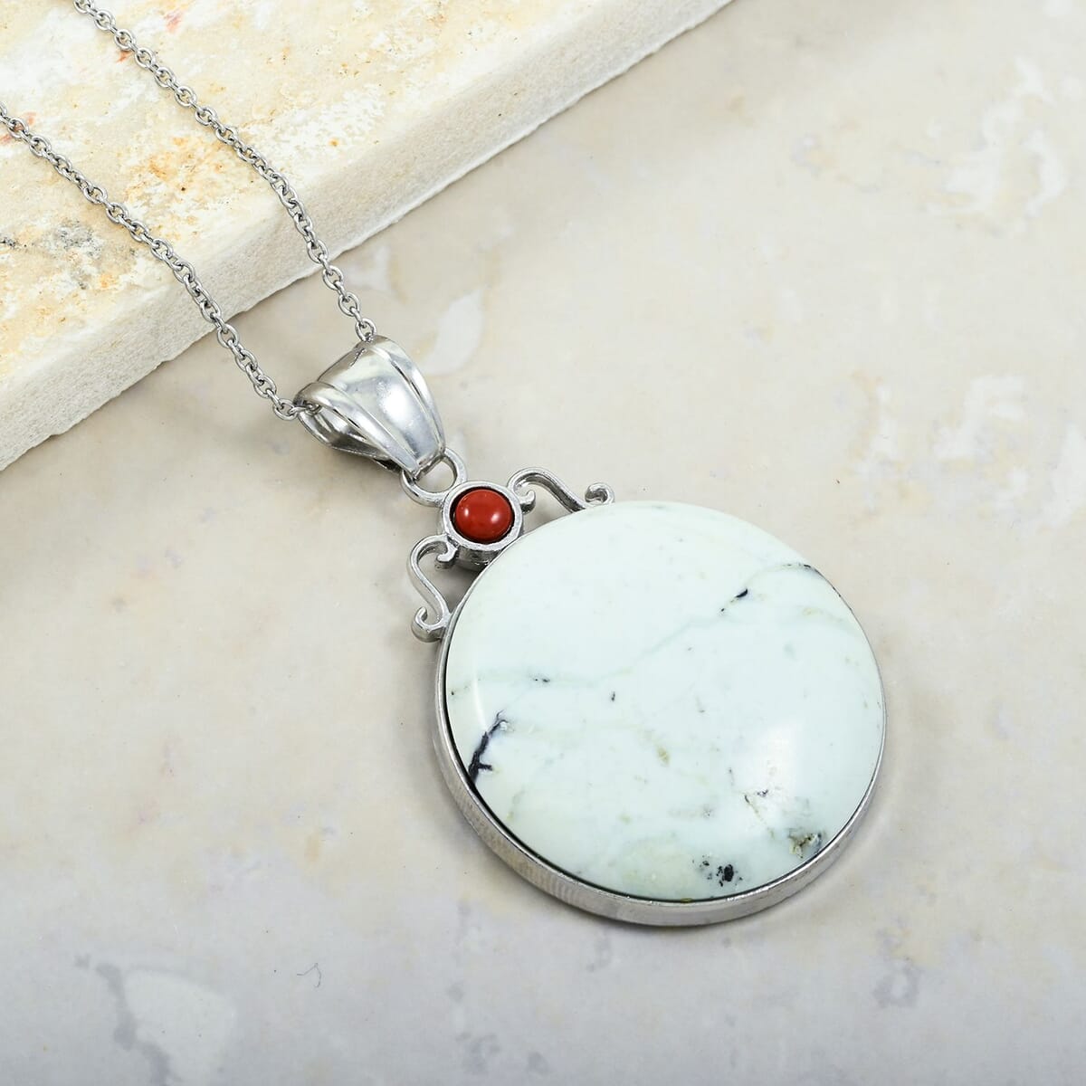 Center Stone Color Varies Inlay Southwest Coyote Moon White Turquoise Jasper 44.50 ctw Pendant in Silvertone with Stainless Steel Necklace (20 Inches) image number 1