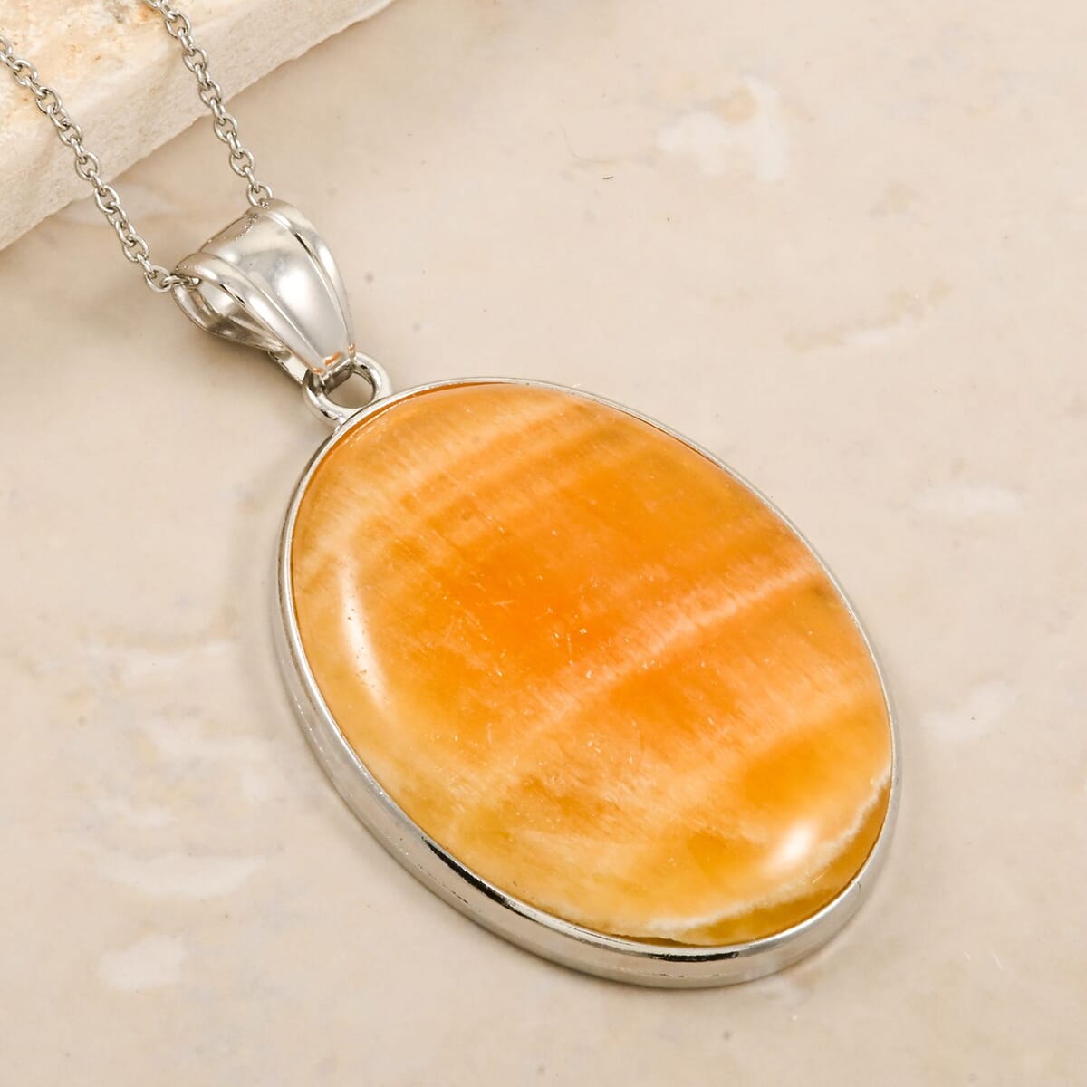 Inlay Frame Oval Golden Imperial Calcite 60.00 Pendant in Silvertone with Stainless Steel Necklace (20 Inches) image number 1