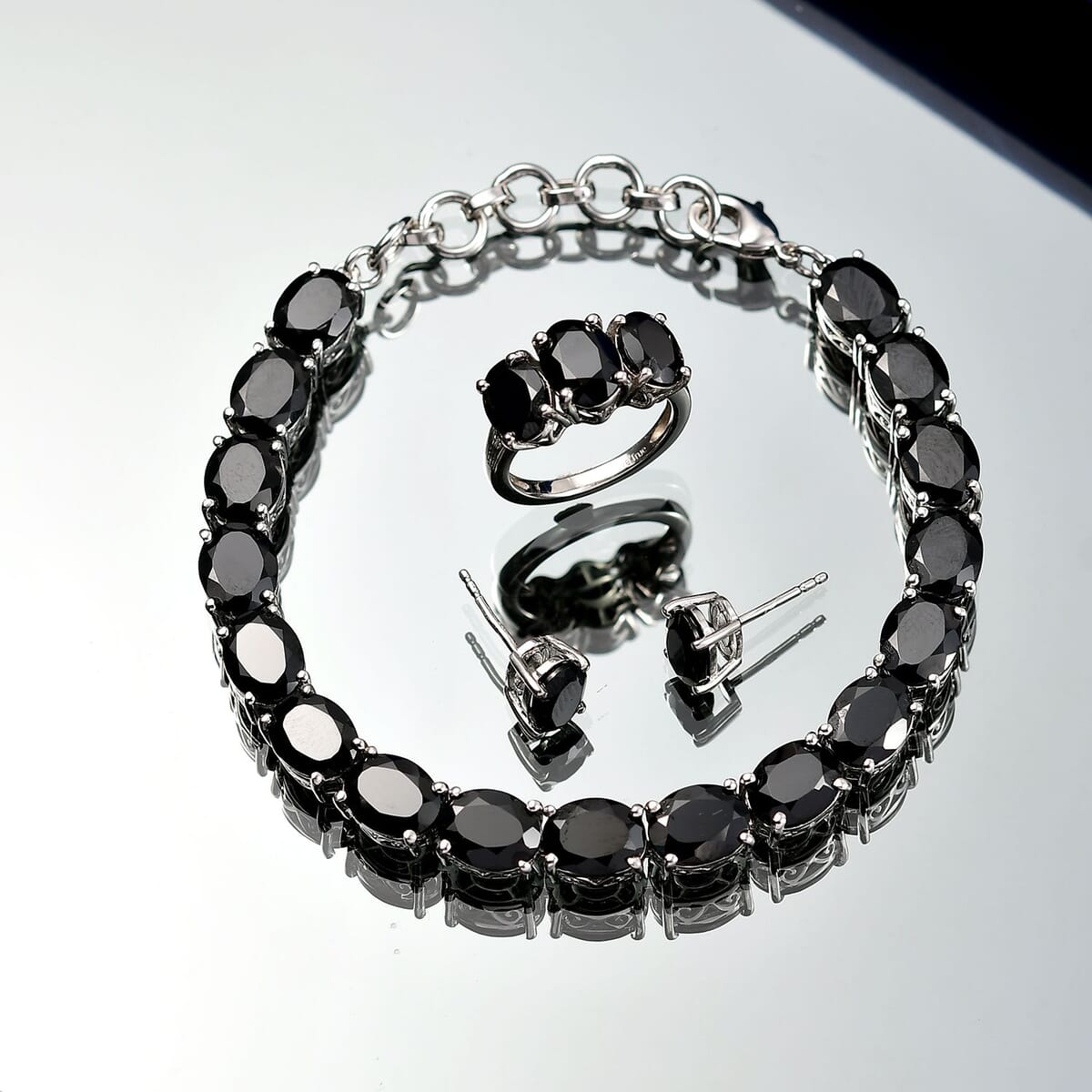Ever True Thai Black Spinel 47.70 ctw 3 Stone Ring (Size 7), Bracelet (8.5in) and Stud Earrings in Platinum Bond image number 1