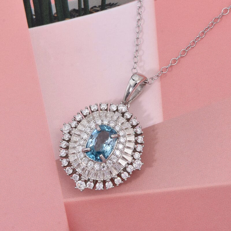 D'Joy Premium Cambodian Blue Zircon and Moissanite 3.50 ctw Regal Halo Pendant Necklace in Rhodium Over Sterling Silver 20 Inches