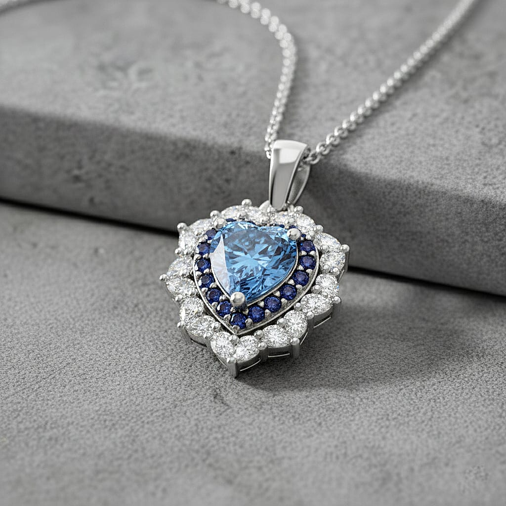 D'Joy Blue and White Moissanite and Blue Sapphire 3.00 ctw Crowned Heart Glow Pendant Necklace in Rhodium Over Sterling Silver 18 Inches