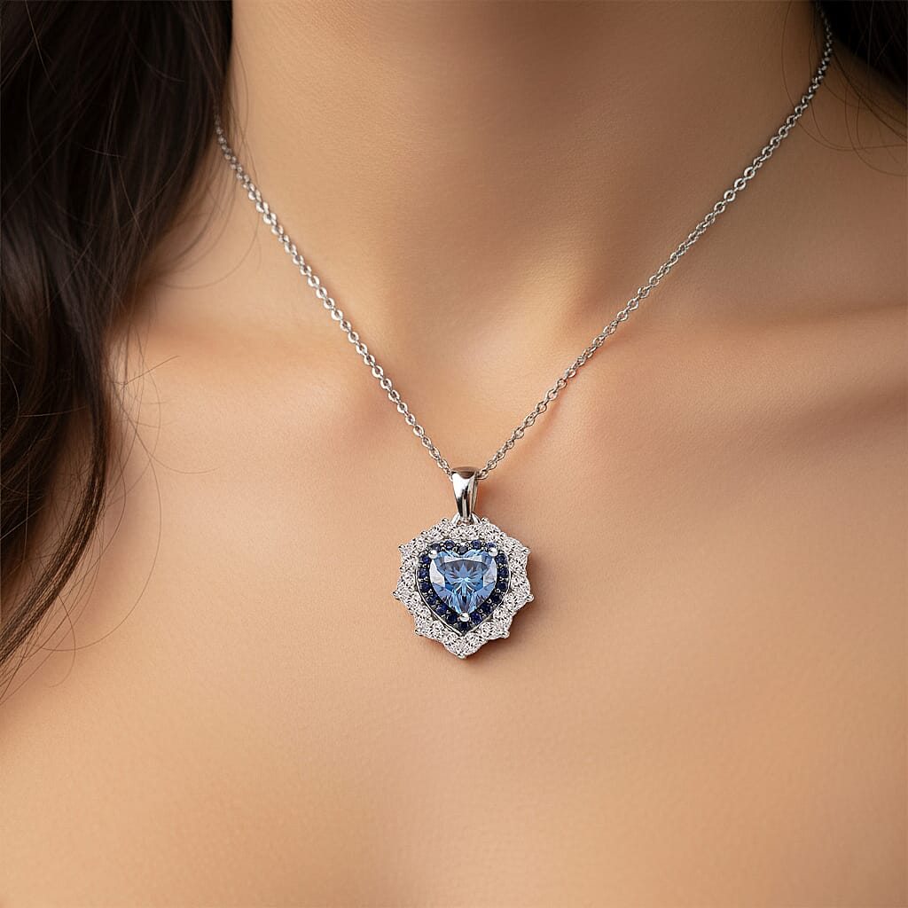 D'Joy Blue and White Moissanite and Blue Sapphire 3.00 ctw Crowned Heart Glow Pendant Necklace in Rhodium Over Sterling Silver 18 Inches