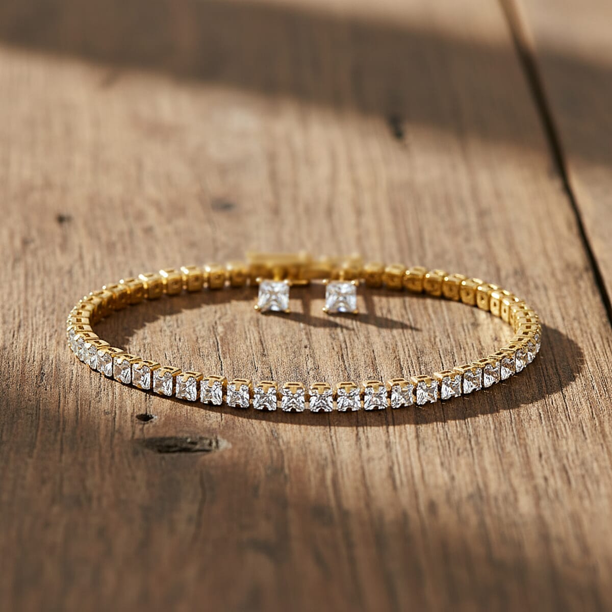 2 Piece Set - Fancy Cut Simulated Diamond 5.60 ctw Tennis Bracel (7.50 In) and Earrings in Goldtone  image number 1