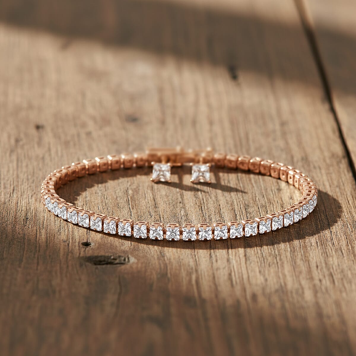 2 Piece Set - Simulated Diamond 5.60 ctw Tennis Bracelet (7.50 In) and Earrings in Rosetone image number 1
