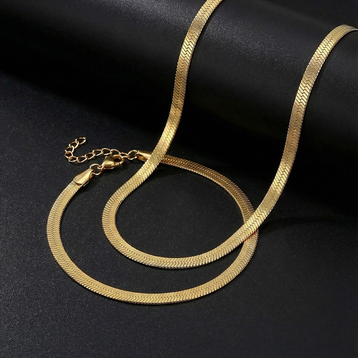 Herringbone Chain Bracelet (8.50In) and Necklace (24 Inches) in ION Plated YG Stainless Steel image number 1