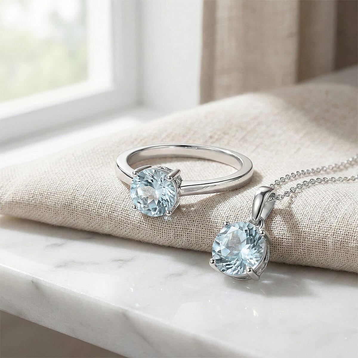 D'Joy Premium Mangoro Aquamarine Ring (Size 7.0) and Pendant Necklace (20 Inches) in Rhodium Over Sterling Silver 1.60 ctw(Del. In 10-12 Days) image number 1