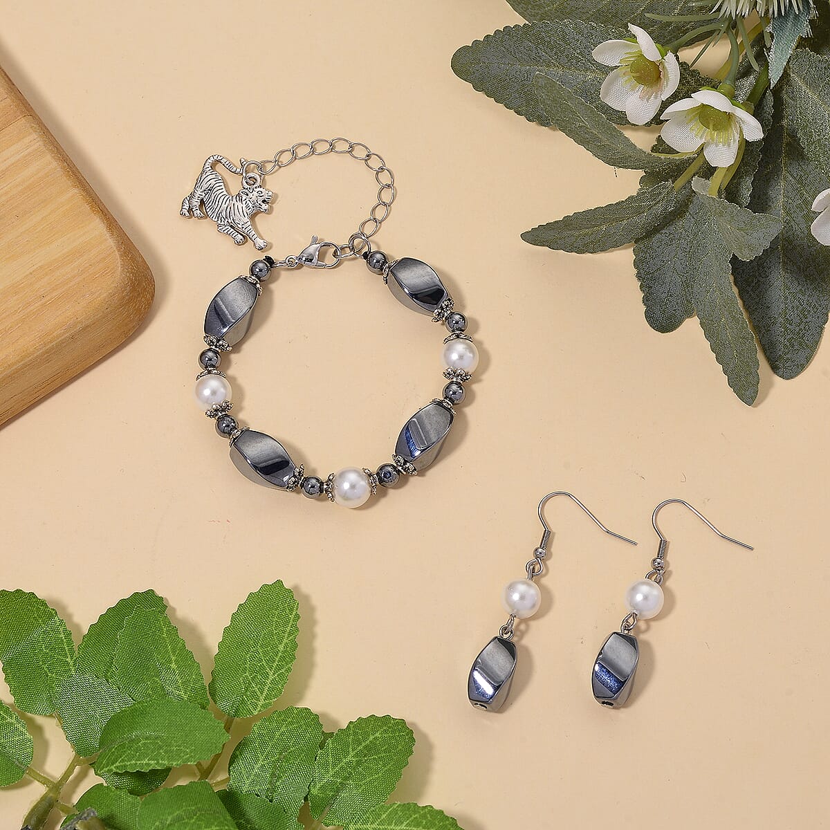 Terahertz 40.00 ctw and White Shell Pearl Beaded Bracelet with Charm (6.5-8.5In) and Earrings in Silvertone and Stainless Steel image number 1