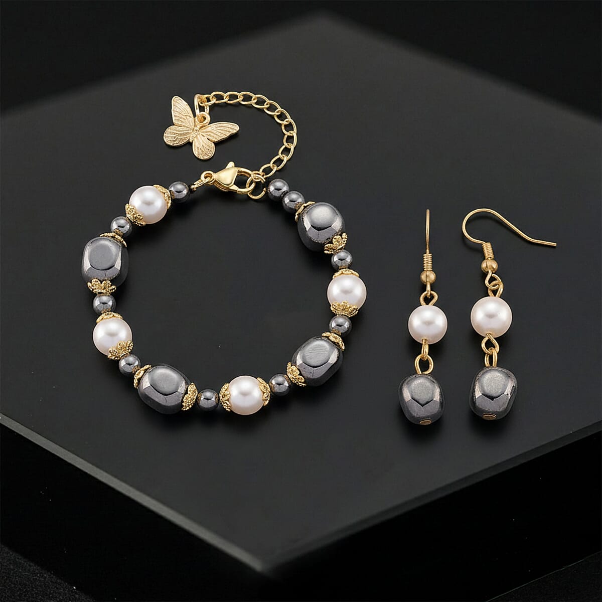 Terahertz 40.00 ctw and White Shell Pearl Beaded Bracelet with Butterfly Charm (6.5-8.5In) and Earrings in Goldtone and Stainless Steel image number 1