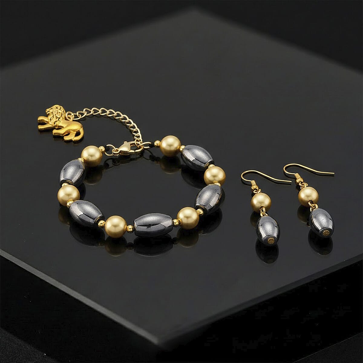 Terahertz 30.00 ctw and Golden Shell Pearl Beaded Bracelet with Lion Charm (6.5-8.5In) and Earrings in Goldtone and Stainless Steel image number 1