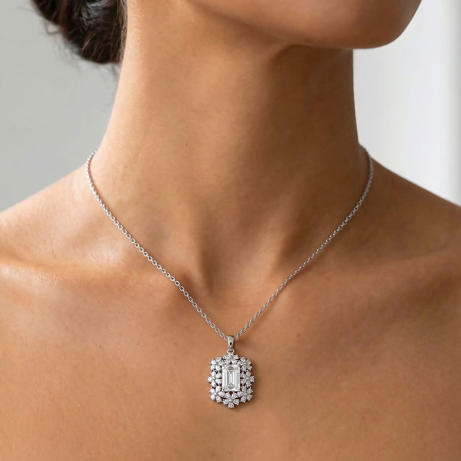 D'Joy Moissanite 5.30 ctw Plumeria Flower Pendant Necklace in Rhodium Over Sterling Silver (20 Inches)