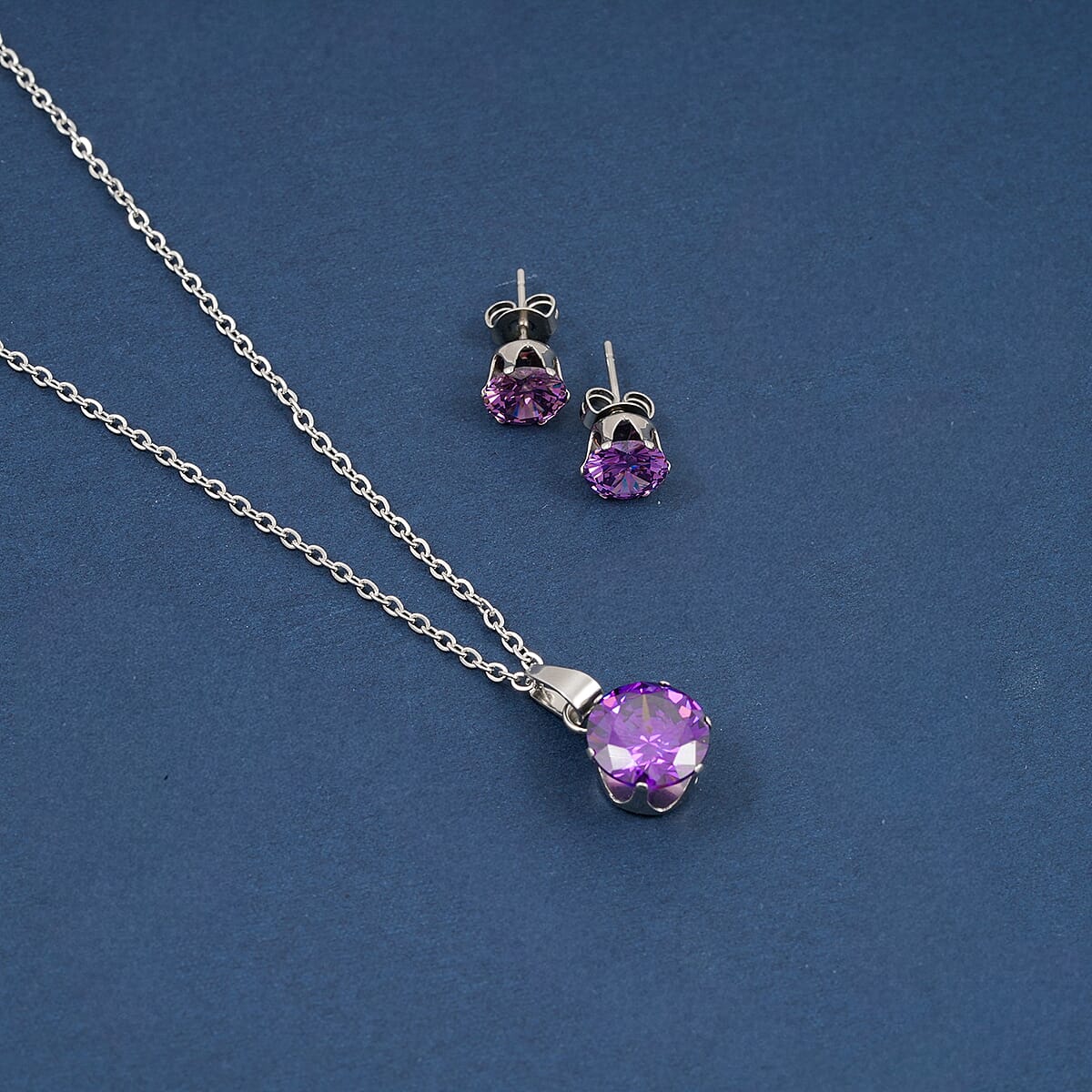 2 Piece Set - Purple Austrian Crystal Solitaire Earrings and Pendant Necklace 18 Inches in Stainless Steel image number 1