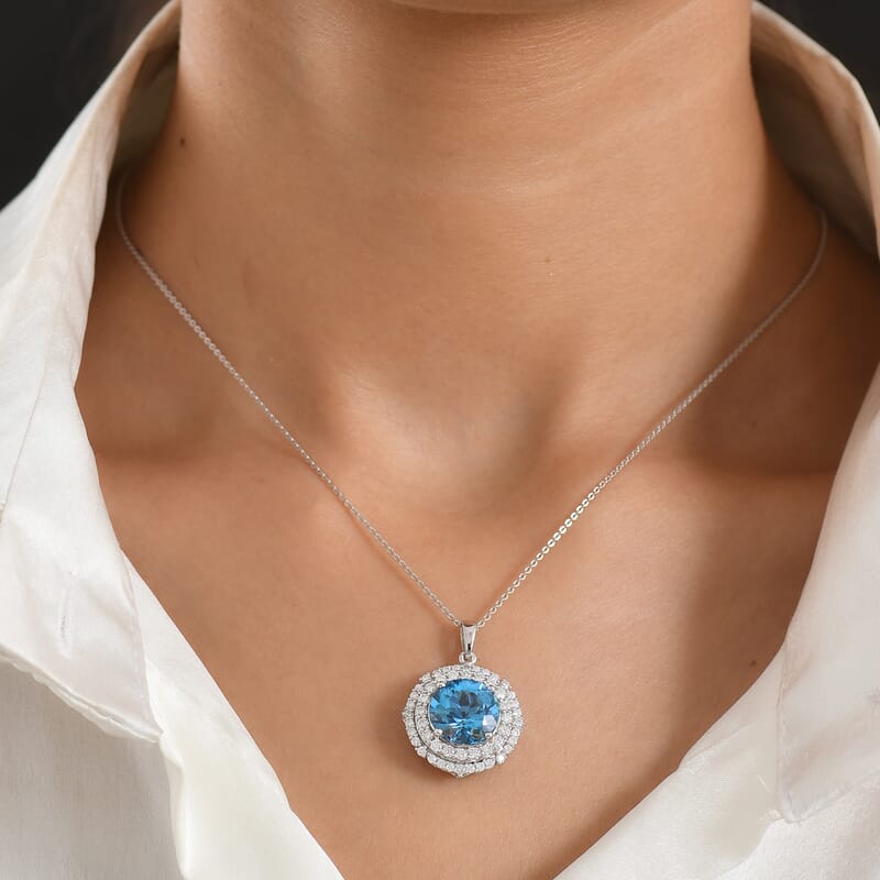Certified & Appraised D'Joy Pinwheel Cut Premium Swiss Blue Topaz and Moissanite 8.00 ctw Pendant Necklace in Rhodium Over Sterling Silver 20 Inches