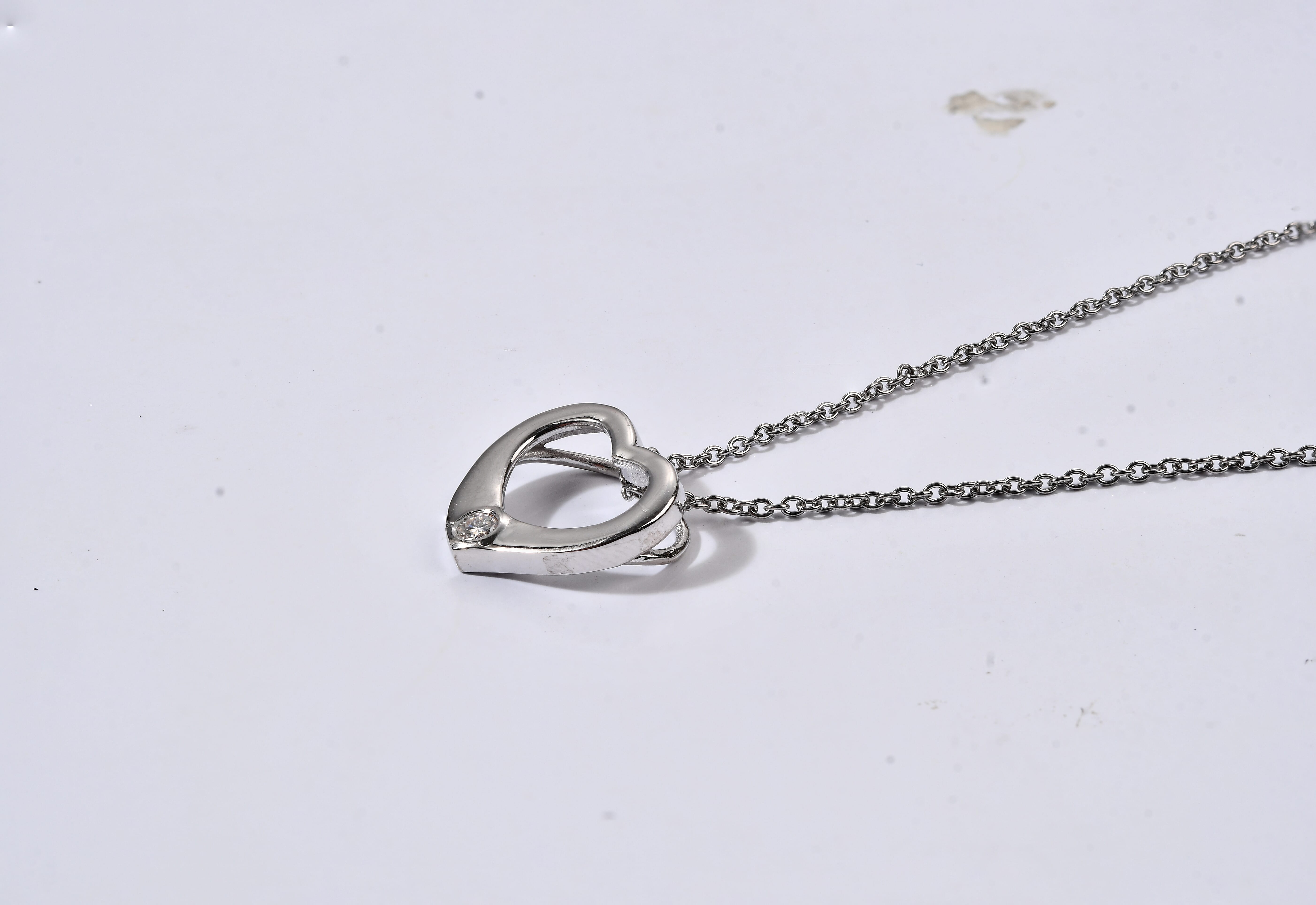 EverTrue Moissanite 0.10 ctw Heart Pendant in Platinum Bond with Stainless Steel Necklace (20 Inches)
