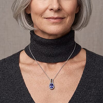 D'Joy Premium Tanzanite, Natural Champagne and White Diamond 1.20 ctw Midnight Royal Halo Pendant Necklace in Rhodium Over Sterling Silver 20 Inches