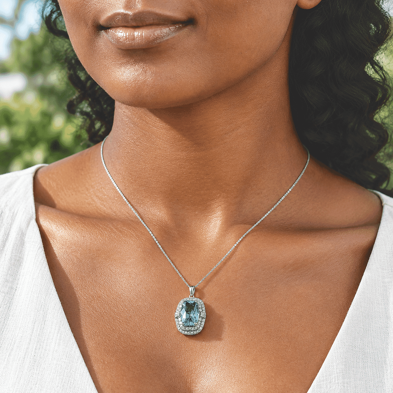 Certified and Appraised D'Joy Premium Swiss Blue Topaz and Moissanite 7.57 ctw Pendant Necklace (18 Inches) in Rhodium Over Sterling Silver