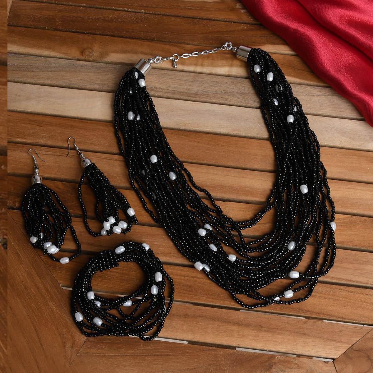 Black Seed Beaded, Simulated Pearl Multi Layered Necklace 20 Inches and Dangle Earrings and Stretch Bracelet in Stainless Steel image number 1