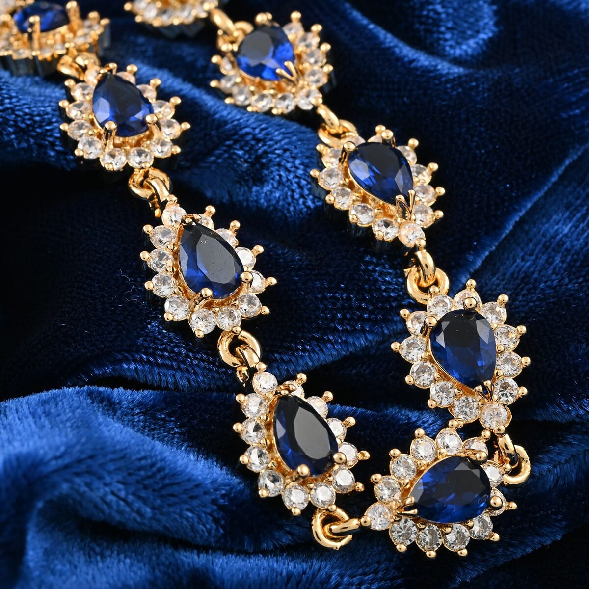 Simulated Blue and White Diamond 7.75 ctw Bracelet in Goldtone (7.50 In) image number 1
