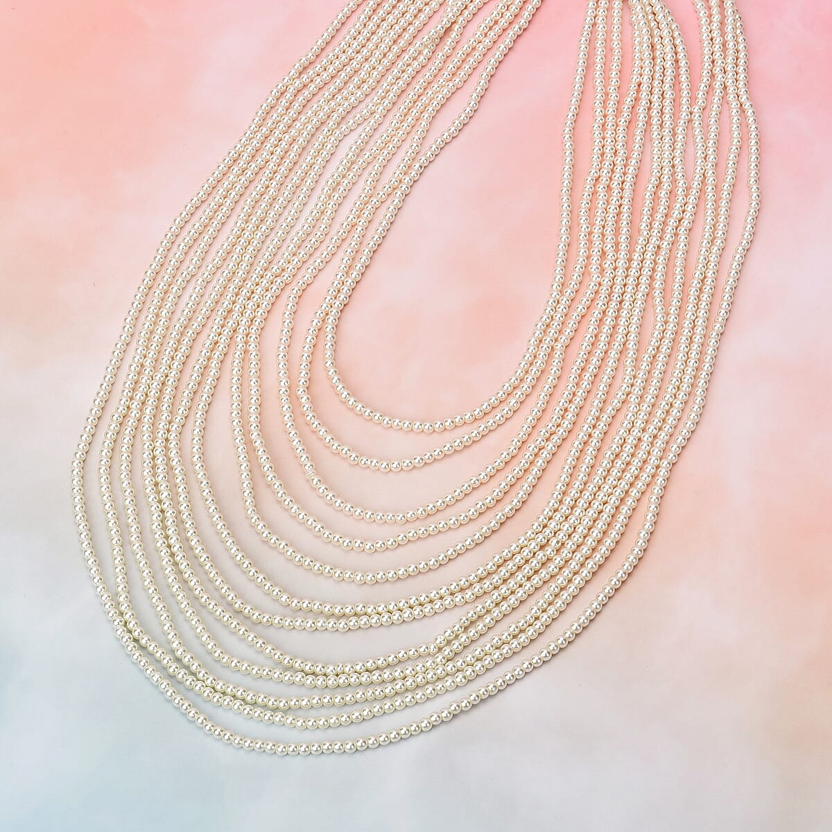 Simulated White Color Pearl Multi Strand Necklace 21-24 Inches in Silvertone image number 1