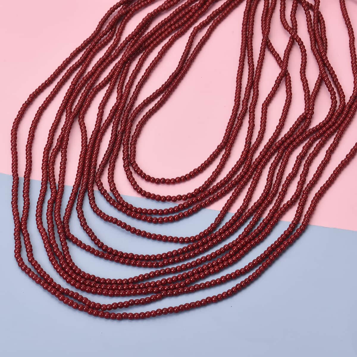 Simulated Red Color Pearl Multi Strand Necklace 21-24 Inches in Goldtone image number 1