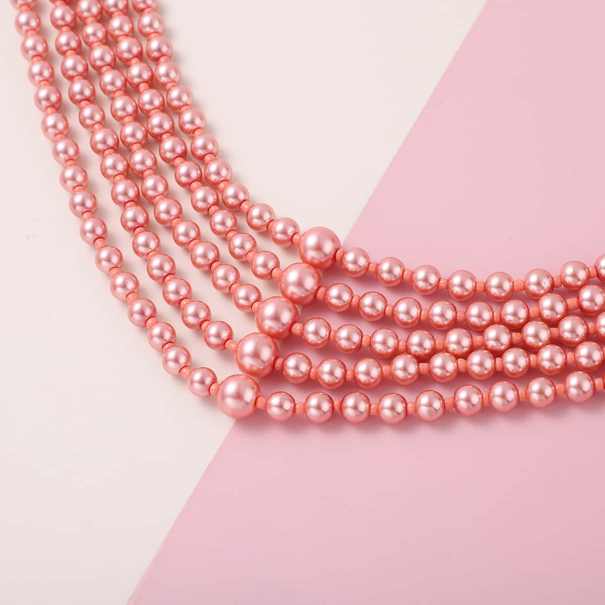 Simulated Peach Pearl Beaded Multi Row Necklace with Charm 22-25 Inches in Rosetone image number 1