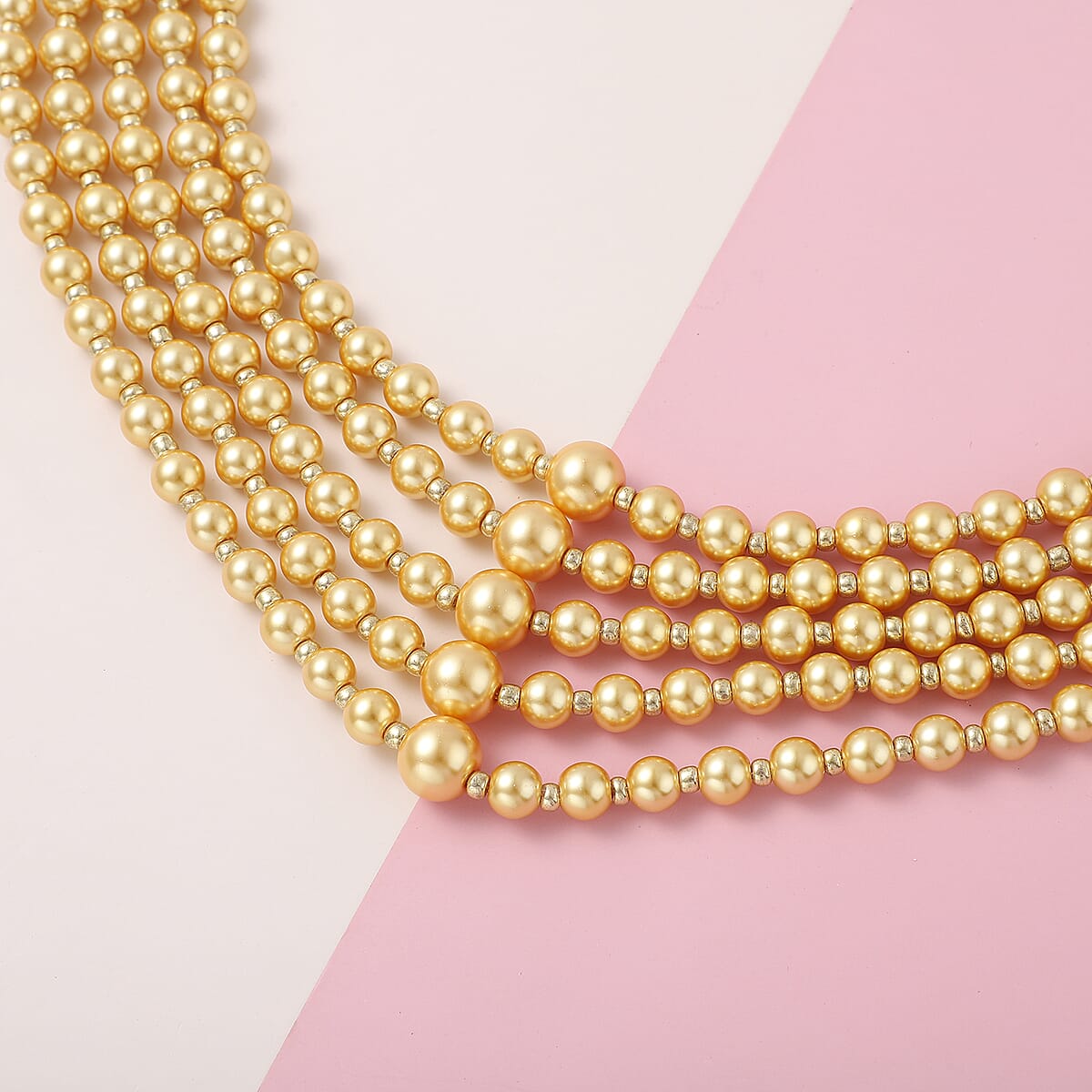 Simulated Golden Pearl Beaded Multi Row Necklace with Charm 22-25 Inches in Rosetone image number 1