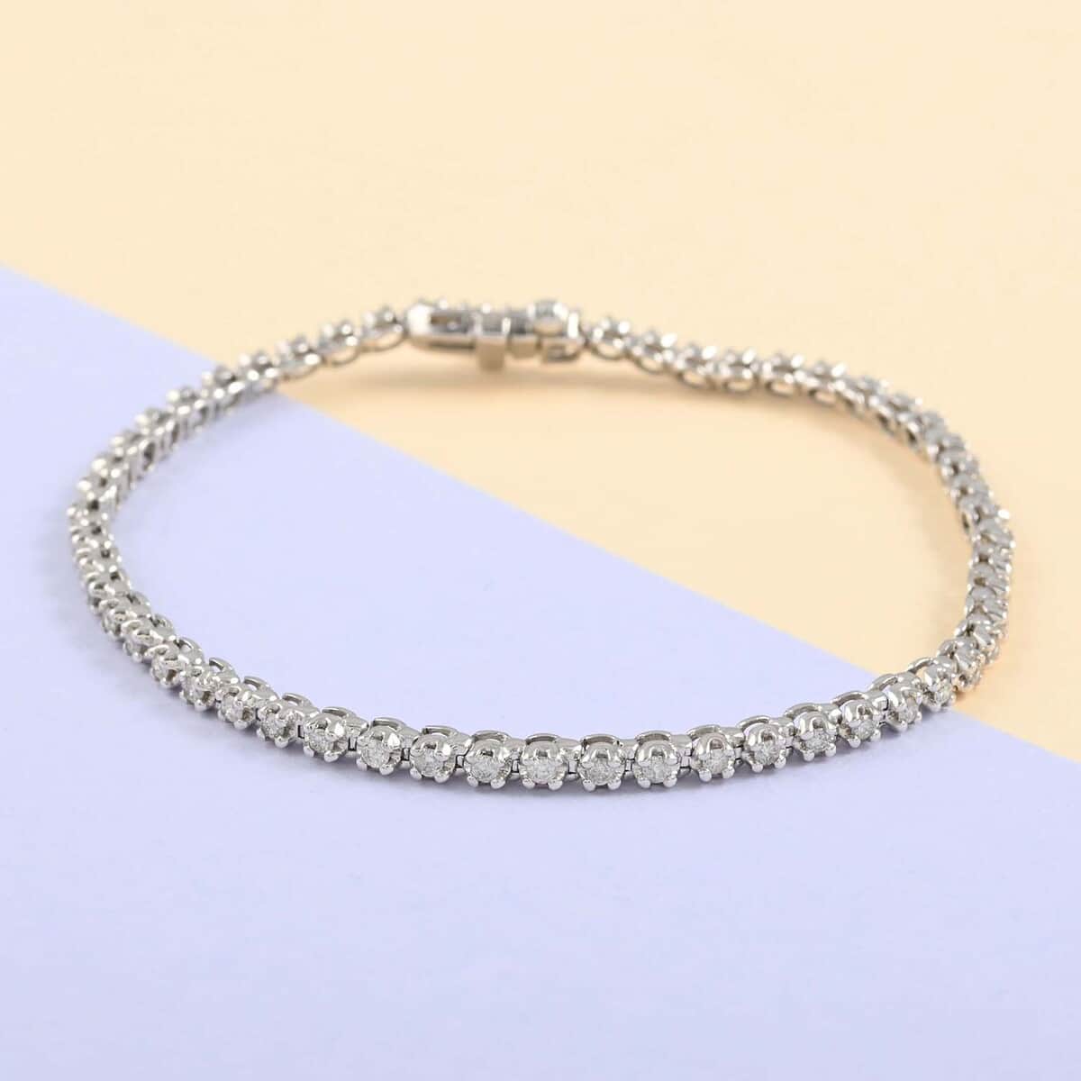NY CLOSEOUT 10K White Gold G-H I2 Diamond Tennis Bracelet (7.00 In) 8 Grams 1.00 ctw image number 1
