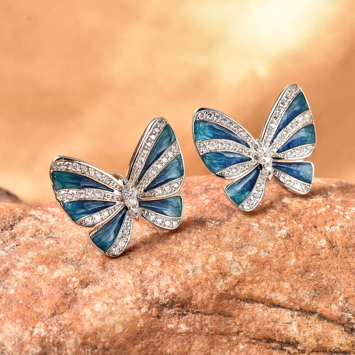 Simulated Diamond Butterfly Earrings in Silvertone image number 1