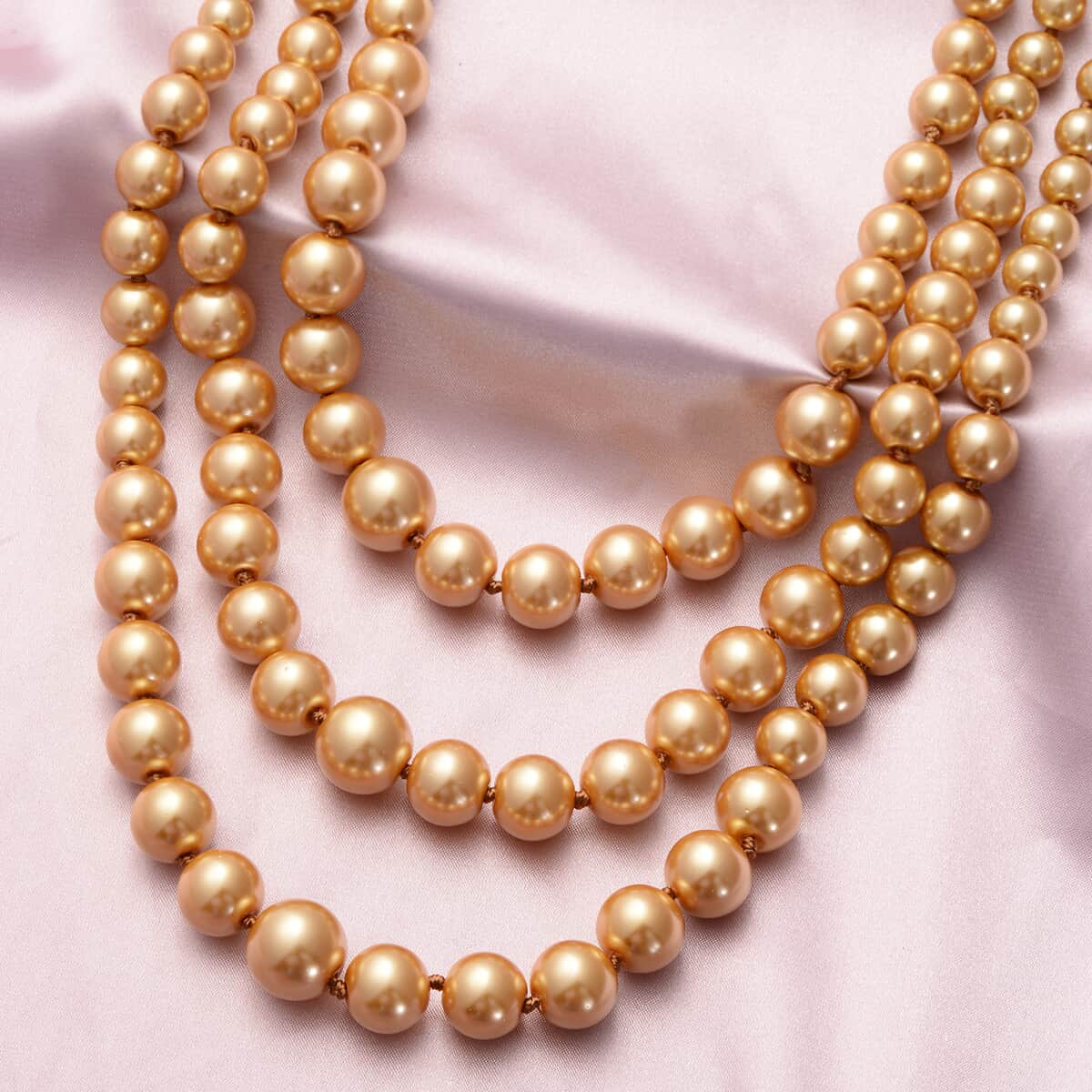 Simulated Golden Pearl Triple Row Necklace 23-27 Inches in Silvertone image number 1