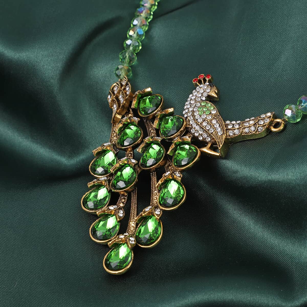 Simulated Green Emerald and Multi Color Crystal Peacock Necklace 21-23 Inches in Goldtone image number 1