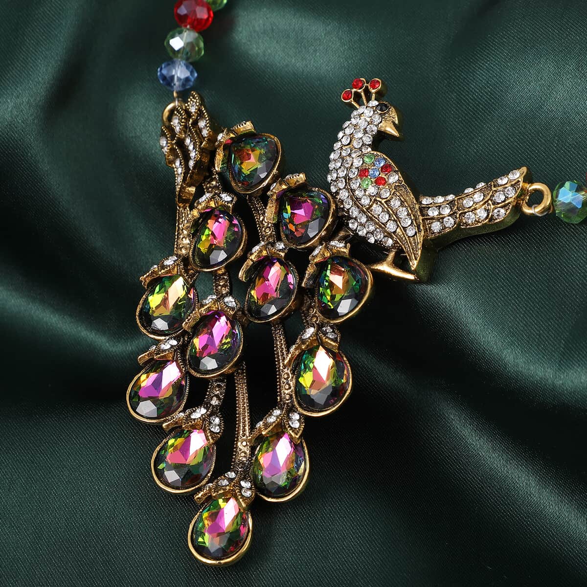 Simulated Multi Color Topaz and Multi Color Peacock Crystal Necklace 21-23 Inches in Goldtone image number 1