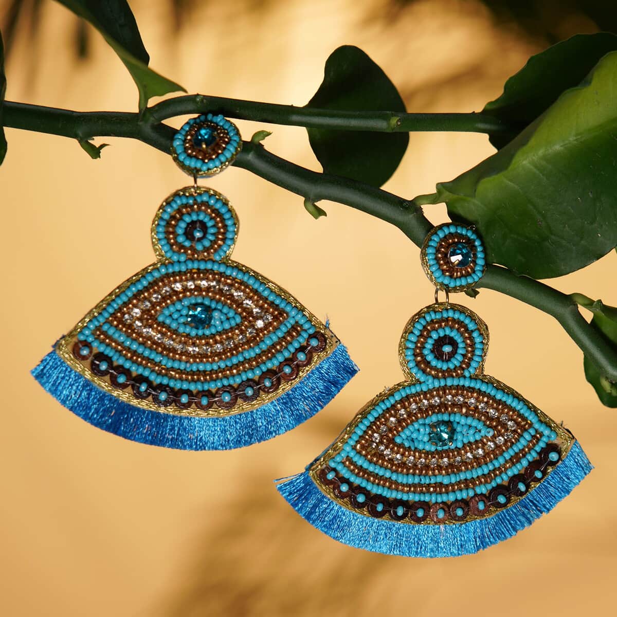 Handcrafted Turquoise Seed Beaded Evil Eye Theme Earrings in Goldtone image number 1