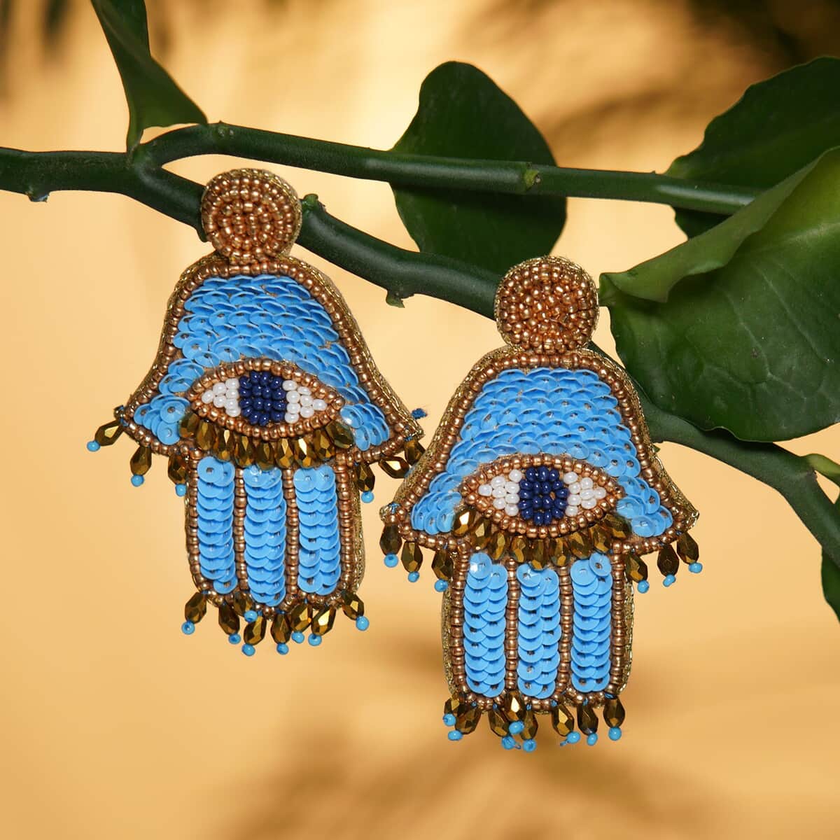 Handcrafted Turquoise Seed Beaded Hamsa Design Earrings in Goldtone image number 1