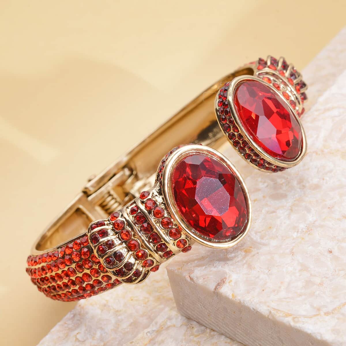 Simulated Ruby and Red Austrian Crystal Openable Bangle Bracelet in Goldtone (7.0 in) image number 1