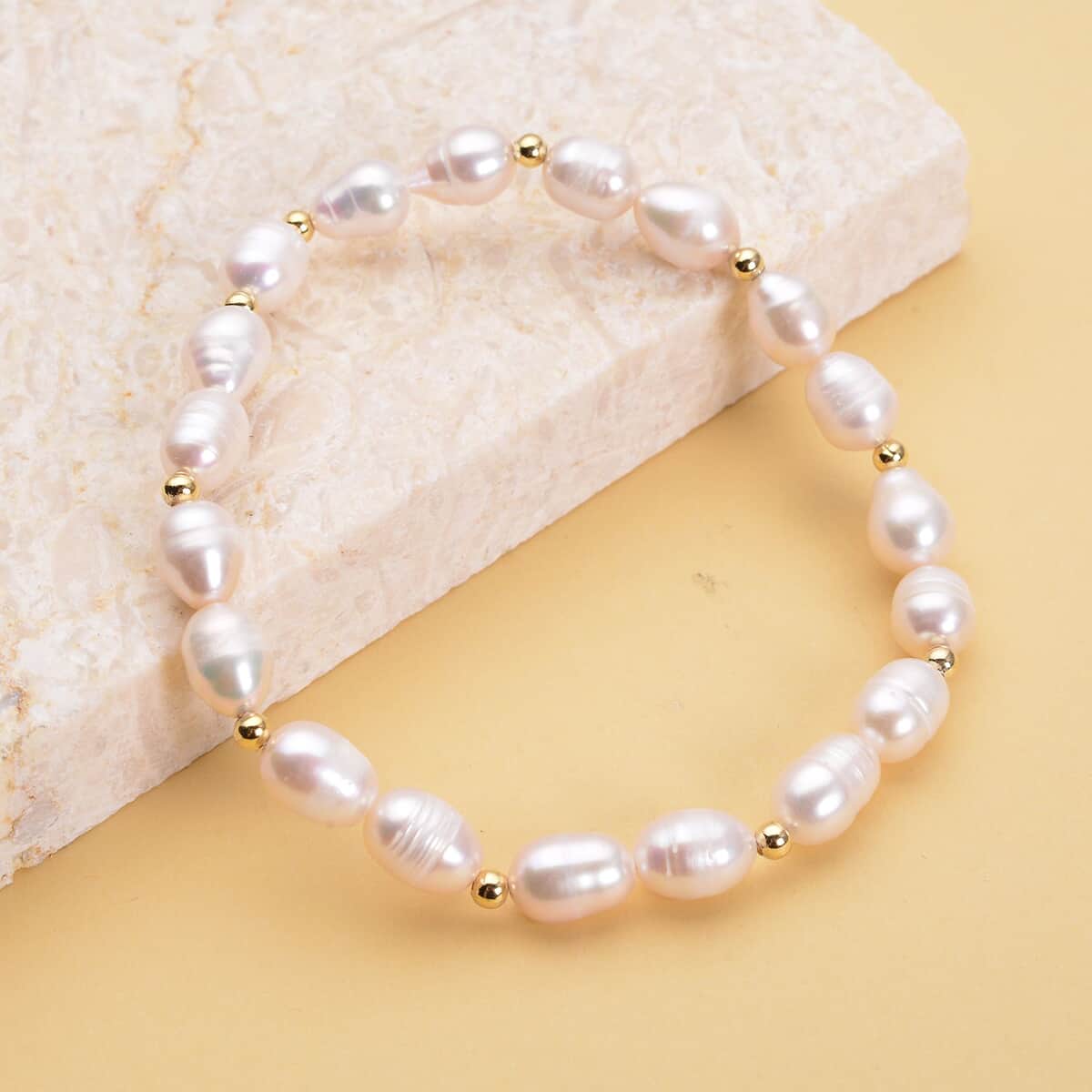 White Freshwater Pearl Stretch Bracelet in Goldtone image number 1