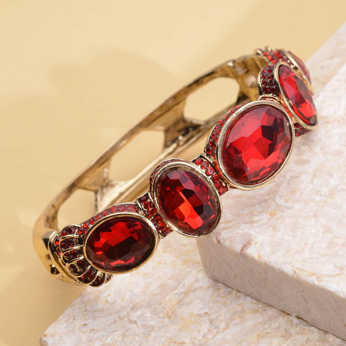 Simulated Ruby and Red Shaded Austrian Crystal Bangle Bracelet in Goldtone (7.0 in) image number 1