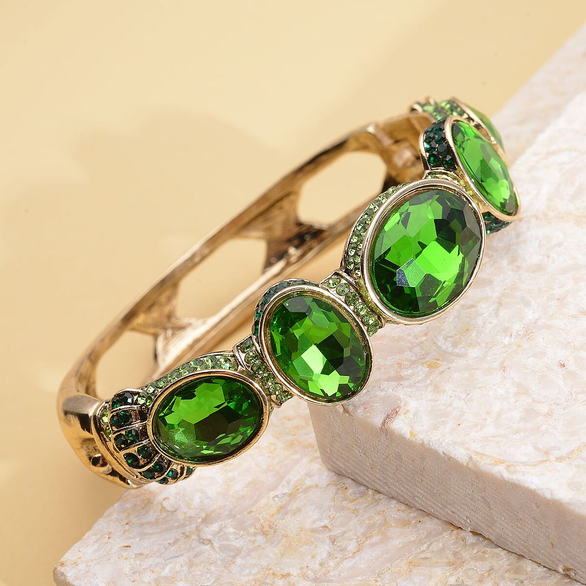 Simulated Emerald and Green Shaded Austrian Crystal Bangle Bracelet in Goldtone (7.0 in) image number 1