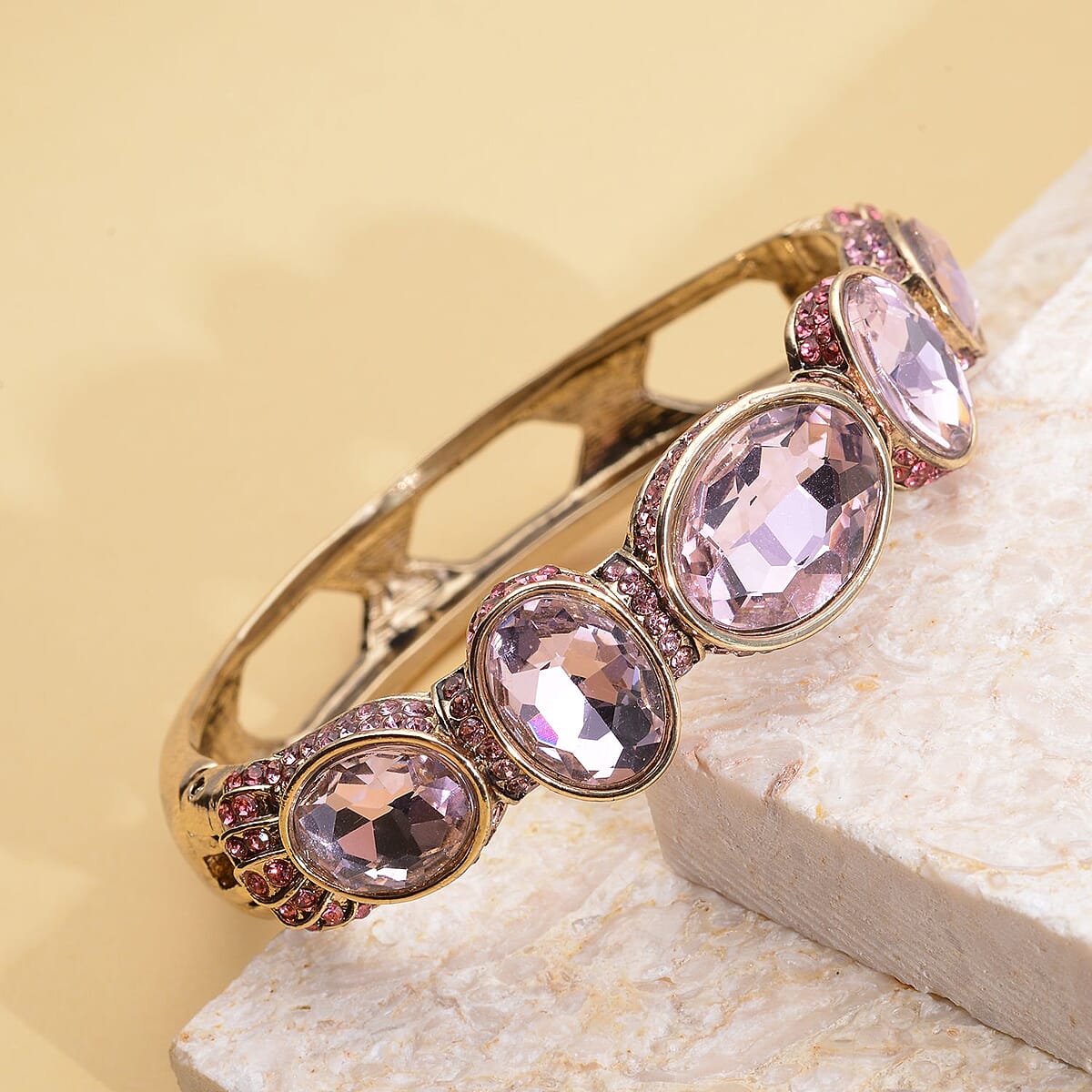 Simulated Pink Sapphire and Pink Shaded Austrian Crystal Bangle Bracelet in Goldtone (7.0 in) image number 1