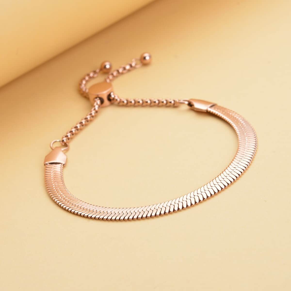 Herringbone Bracelet With Adjustable Ball in ION Plated Rose Gold Stainless Steel (6-9In) image number 1