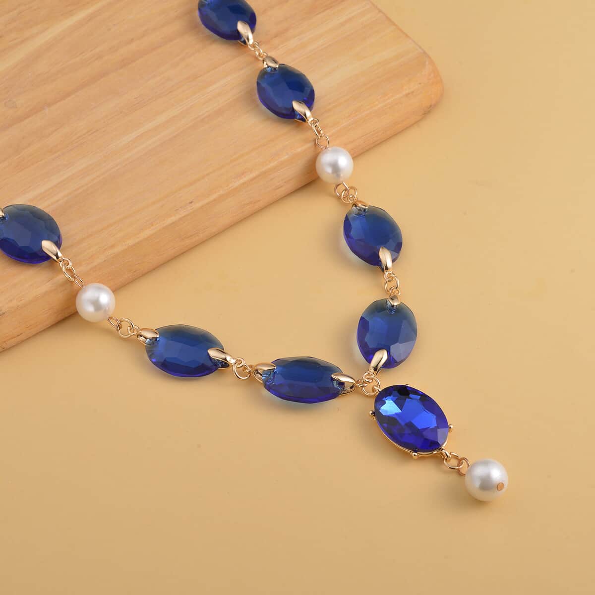 Simulated Blue Sapphire and White Pearl Necklace 22-23 Inches in Goldtone image number 1