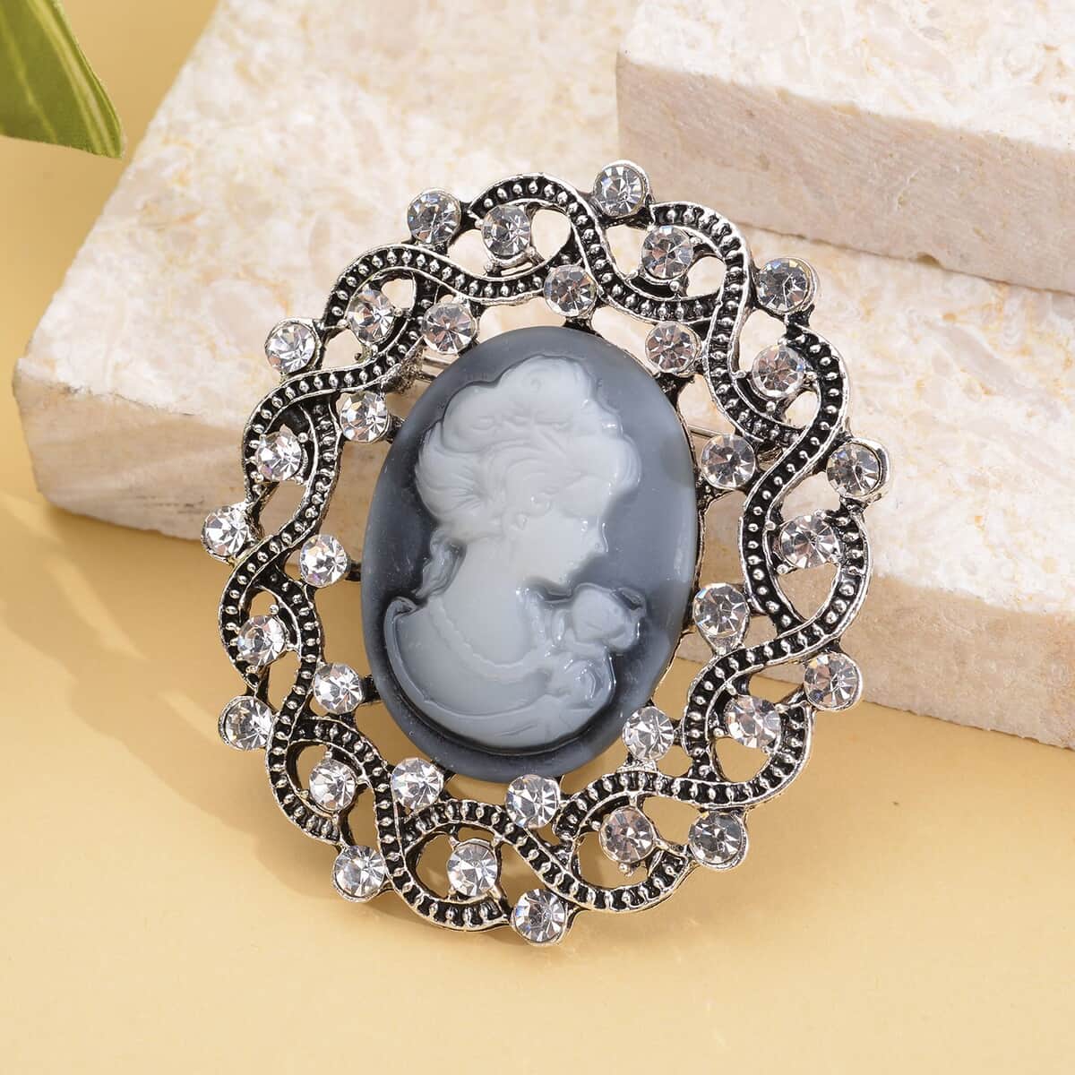 Gray Resin Cameo and Austrian Crystal Brooch Silvertone 20.00 ctw image number 1