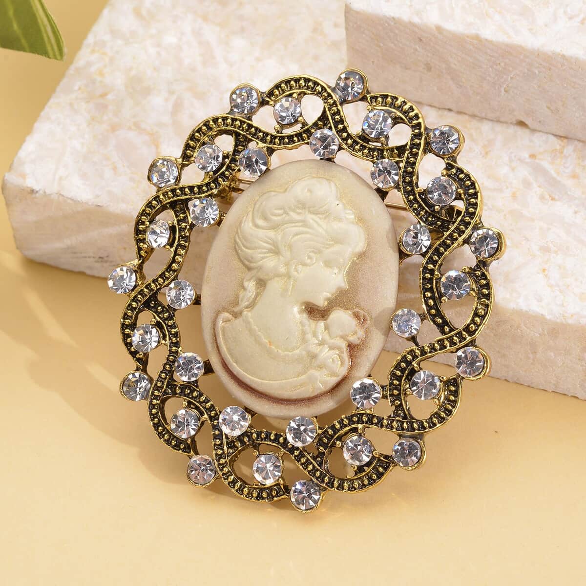 Brown Resin Cameo and Austrian Crystal Brooch in Goldtone 20.00 ctw image number 1