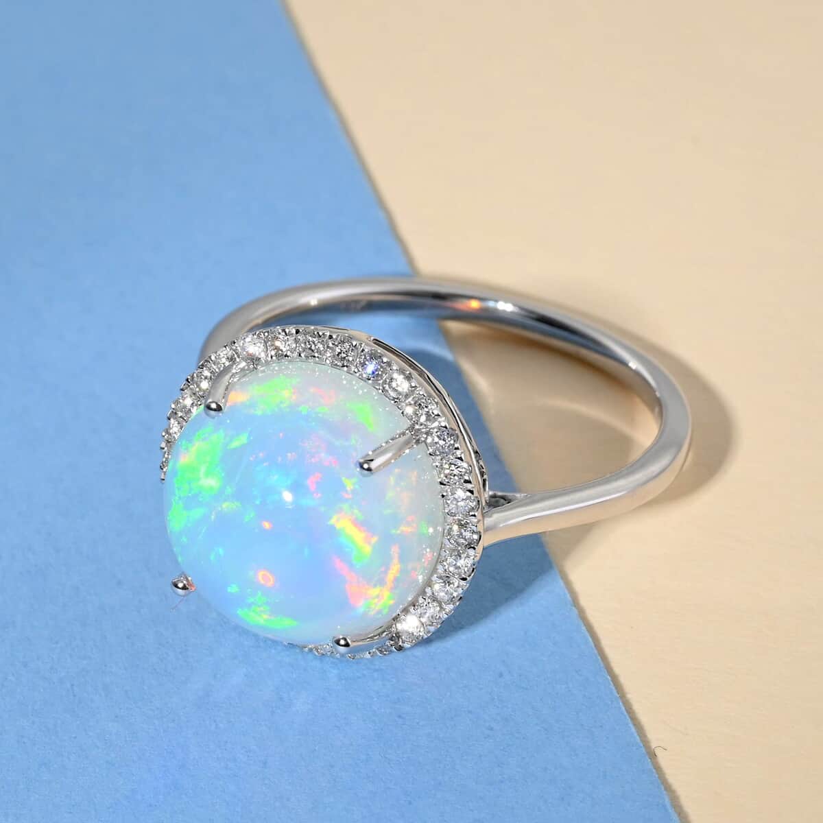 Inspired by a halo design, this AAA Ethiopian Welo Opal ring symbolizes sanctity and perfection. Halo rings are popular throughout history for their uniqueness in illuminating the gemstone i image number 1