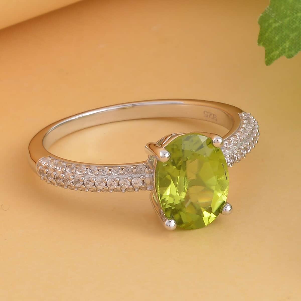 Peridot and White Zircon Ring in Rhodium Over Sterling Silver (Size 9.0) 2.35 ctw image number 1