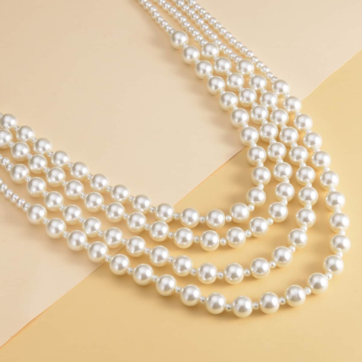 Simulated White Pearl 4-12mm Necklace 21-23 Inches in Goldtone image number 1