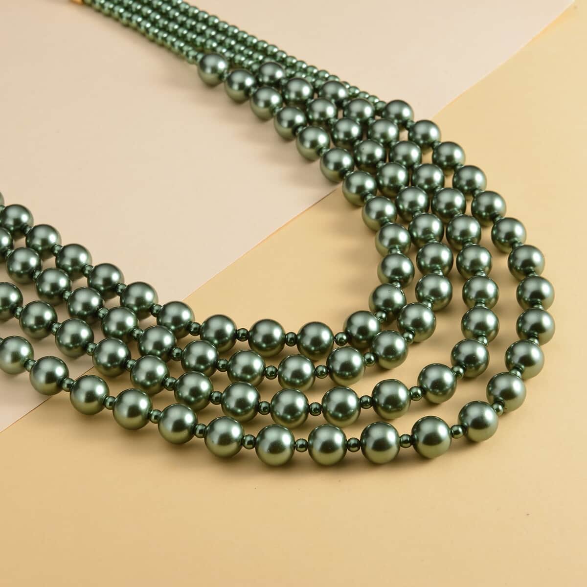 Simulated Peacock Color Pearl 4-12mm Necklace 21-23 Inches in Goldtone image number 1