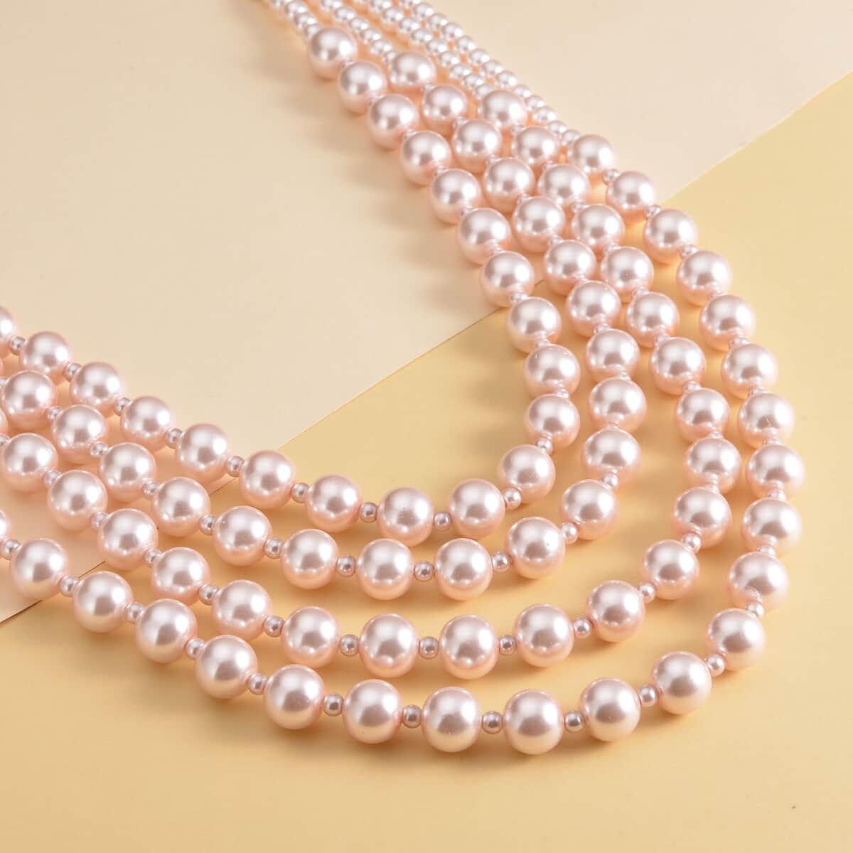 Simulated Pink Pearl 4-12mm Necklace 21-23 Inches in Goldtone image number 1