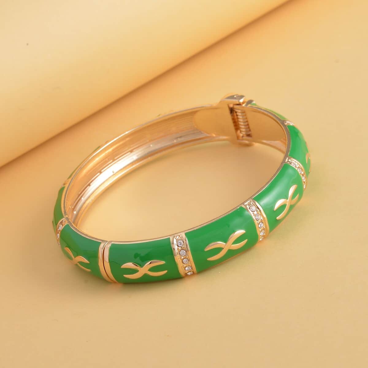 White Austrian Crystal and Green Enameled Bangle Bracelet (7.25 in) in Goldtone image number 1