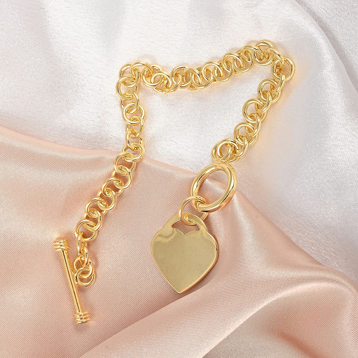 Curb Chain Toggle Lock Bracelet with Heart Charm in Goldtone (7.50 In) image number 1